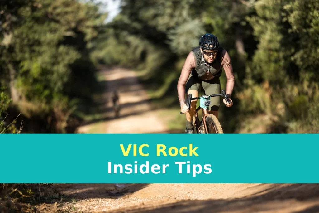 A man riding a bike down a dirt road