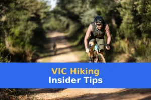 A man riding a bike down a dirt road