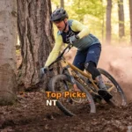 a man riding a mountain bike through a forest