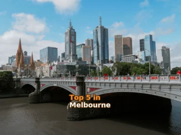 white bridge across city buildings