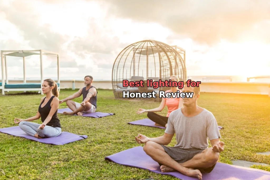 man in gray crew neck t-shirt sitting on green grass field