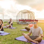 man in gray crew neck t-shirt sitting on green grass field