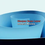 Abstract blue spiral paper sculpture with dark base