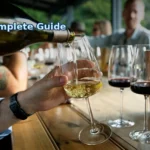 a group of people sitting at a table with wine glasses