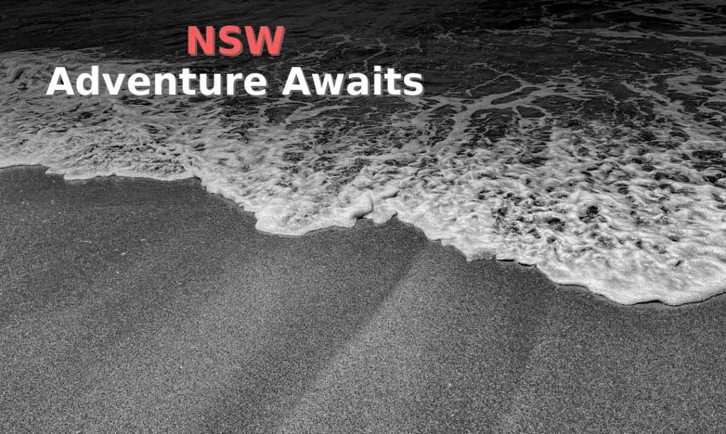 Waves crash onto a sandy beach.