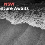 Waves crash onto a sandy beach.