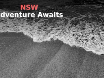 Waves crash onto a sandy beach.